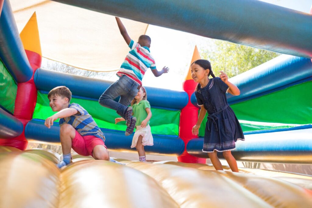 Kids enjoying inflatable bounce house rental in Willis TX